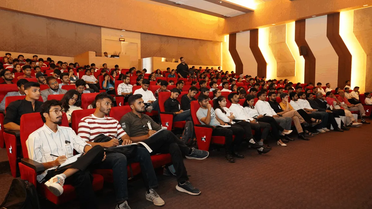 The audience seated in the auditorium